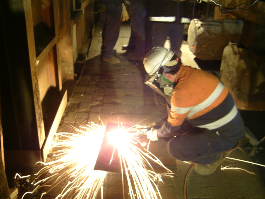 Oxy-cutting some steel plate, making a part for the job